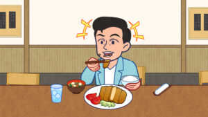 とんかつを食べる男性
