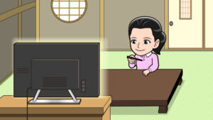 テレビを見ながら箸の使い方を練習する人